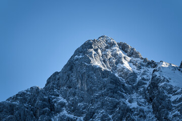 snow covered mountains with blue sky, clouds a little bit sun - Zugspitze, Alps