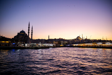 Fototapeta na wymiar sunset in istanbul, galata bridge looks great at sunset. passenger ship