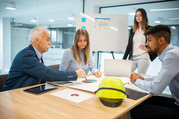 business people at a meeting talking about company growth