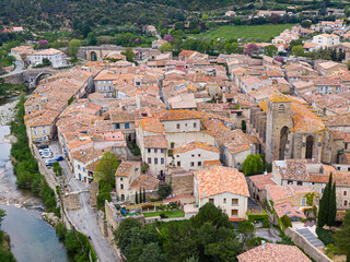 Aerial view of Lagrasse medieval city, Aude, Occitanie. the city is built along the river Orbieu