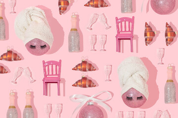 Christmas creative pattern with baubles with towel turban wraps, champagne, glasses, croissant and...