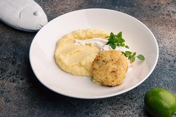 Fish cutlet with mashed potatoes and sauce
