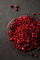 fresh lingonberry berries on a stone board