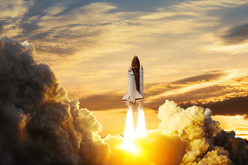 Spaceship lift off. Space shuttle with smoke and blast takes off into space on a background of...