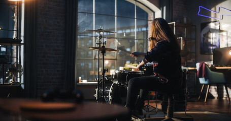 Portrait of a Young Drummer Playing at a Band Rehearsal, Doing Tricks with Drumsticks. Learning Drum Solo on Drums and Cymbals in Living Room Loft Apartment. Evening or Night Jam Session.