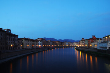 Night view of embankments in Pisa, Italy