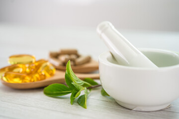 Alternative medicine herbal organic capsule with vitamin E omega 3 fish oil, mineral, drug with herbs leaf natural supplements for healthy good life.