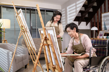 Group of Asian senior people are enjoy  painting at elderly healthcare center, elder group therapy concept.