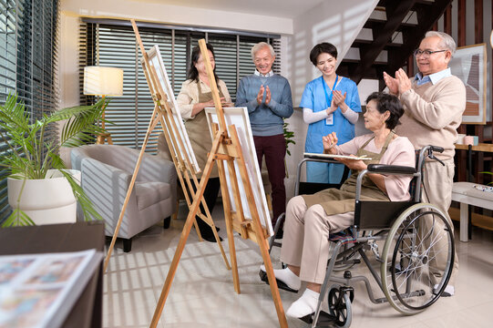 Group of Asian senior people are enjoy  painting at elderly healthcare center, elder group therapy concept.