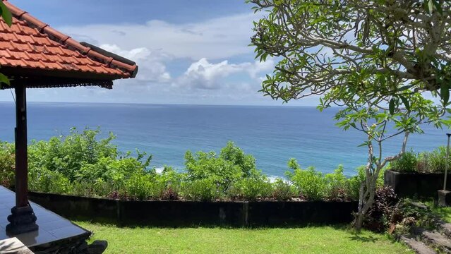 Ocean viewed from Gunung Payung Temple, Badung Regency, Bali, Indonesia. There is a resting place to enjoy the view.