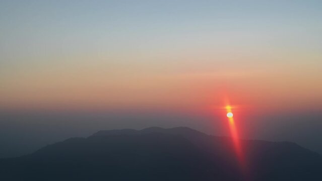 Blur motion of Beautiful sunrise on khao san nok wua kanchanaburi.Khao San Nok Wua is the highest mountain in Khao Laem National Park. It is 1767 meters above sea level.
