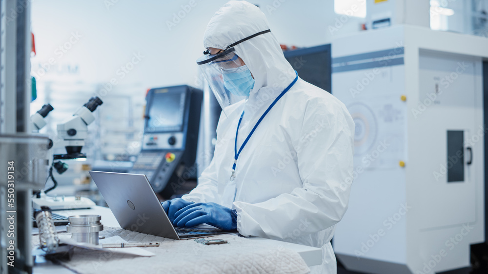 Leinwandbilder electronic manufacturing factory: engineer in sterile coverall working on laptop computer, examining