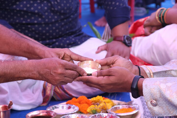 Obraz na płótnie Canvas In India, yogurt is held in the hand of a wedding ceremony and in the hand of a Hindu priest in a religious ceremony