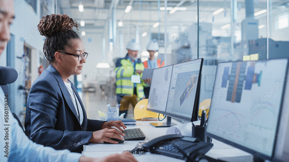 Poster Portrait of an Industrial Engineer Drafting Blueprint of a Heavy Industry Machine Parts on a Computer CAD Software in a Factory. Modern Technological Industry 4.0 Research and Development Center.