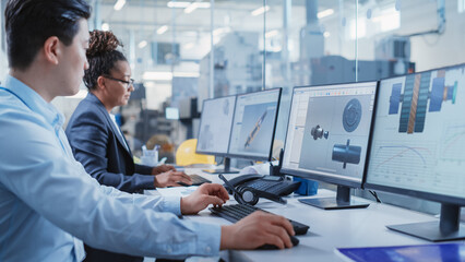 Fototapeta premium Factory Office Design Agency: Industrial Engineers Drafting Equipment 3D Layouts of a Heavy Industry Machine Parts on a Computer CAD Software. Modern Technological Research and Development Center.