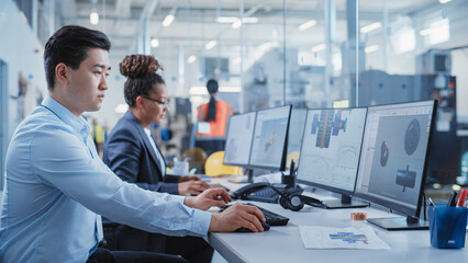 Factory Office Room: Industrial Engineers Developing Models of a Heavy Industry Machine Parts on a Computer 3D Software. Modern Technological Industry 4.0 Research and Development Center.