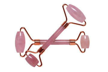 Gua Sha massage tools. Close-up of two pink jade facial roller or beauty roller for better blood...