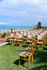 chairs lined up for beach wedding ceremony, horizon line