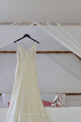 wedding dress hanging on hanger