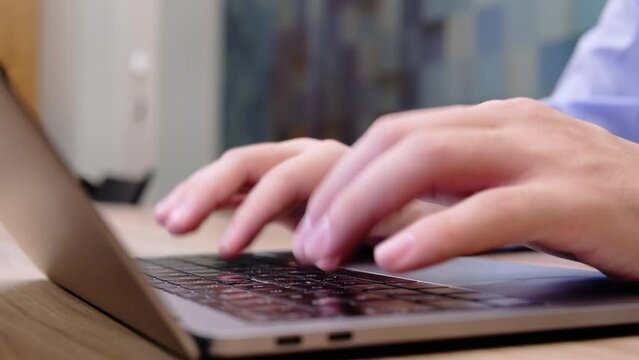 typing on personal laptop using ten fingers fluently, close-up video in 4k resolution
