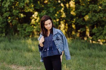 A beautiful young woman walking in the forest