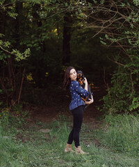 young girl on a walk with her dachshund