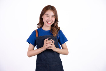 Small business shop owner. Apron asian woman smiling proud and happy isolated on white background. Young entrepreneur asian female.