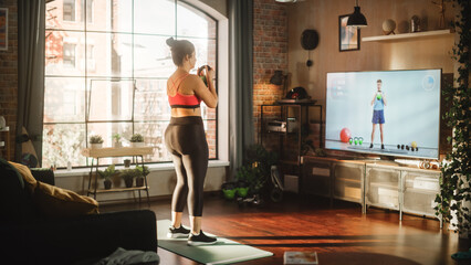 Home Training: Gorgeous Plus Size Body Positive Girl Training with Personal Trainer via Online Video Tutorial. Genuine Woman Using Workout Service Fitness Streaming App for Virtual Training. Back View