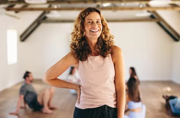 Foto op Plexiglas Mature woman standing in a fitness studio © Jacob Lund