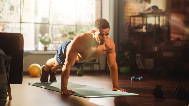 Strong Athletic Black Man Does Shirtless Workout At Home Gym, Doing Push Ups. Lean Fit Muscular Mixed Race Sportsman Staying Healthy, Training At Home. Sweat And Determination Lead To Success