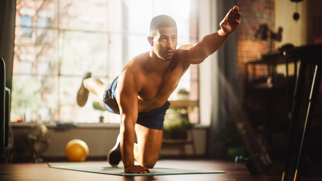 Strong Athletic Black Man Does Shirtless Workout At Home Gym, Opposite Arm Leg Exercise. Lean Fit Muscular Mixed Race Sportsman Staying Healthy, Training. Sweat And Determination Lead To Success