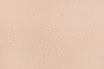 drops on a pastel beige background