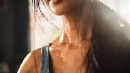 Close up Shot of a Young Adult woman's neck Sweating After Heavy Workout at Home. Successful...