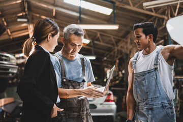 professional male technician mechanic man working to repair maintenance automobile at auto car garage service, talking with vehicle owner client about workshop job, automotive engine business shop