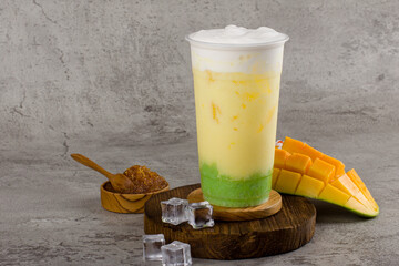 Boba or tapioca pearls is taiwan bubble milk tea in plastic cup with mango sticky rice flavor on...