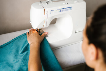 Close-up of a fashion designer sewing machine stitching fabric
