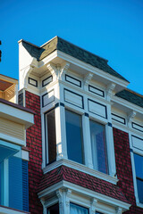 Decorative building facade on exterior of house or home in the suburban part of the historic districts of san francisco california
