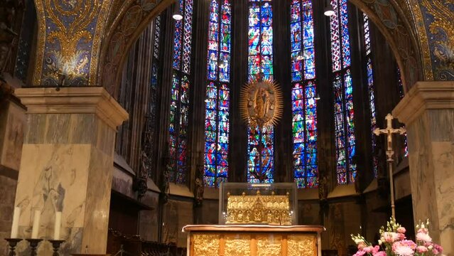 Aachen, Germany - October 10, 2022: Beautiful vintage stained glass windows inside in front of the altar of the ancient Aachen Cathedral