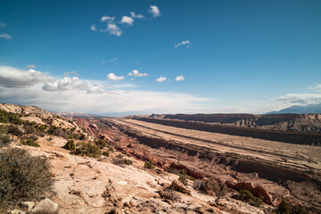 The Strike Valley and  Waterpocket Fold, a 100-mile long geological feature in Capitol Reef National Park in Utah. Clouds gather in the distance and the Henry Mountains are seen in the east.