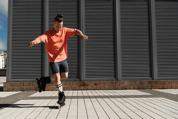 Focused roller skater riding on one leg on urban street.