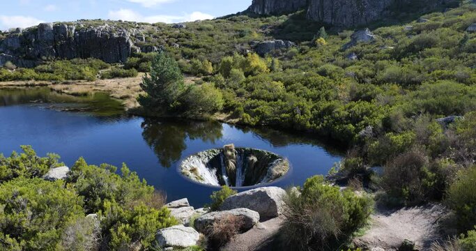Cov&atilde;o dos Conchos in Serra da Estrela, Portugal. Travel and adventure. Nomad life. Hiking lifestyle. Best destinations in the world. Human made construction on the lake.