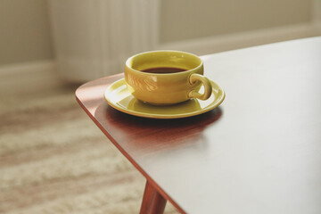 cup of coffee on a wooden table