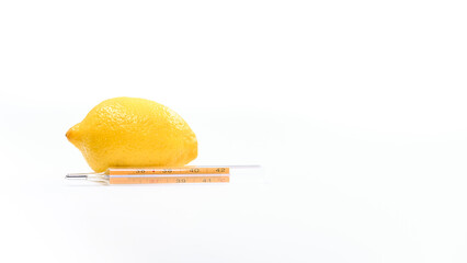 Thermometer with lemon on white background. Vitamins are important for immunity.