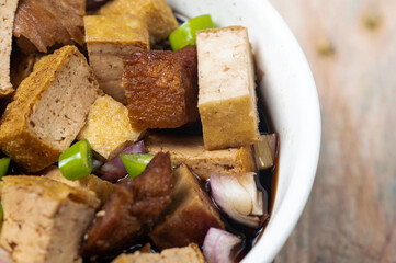 Tokwa't baboy is a typical Philippine appetizer or pulutan. It consists of pork ears, pork belly and deep-fried tofu, and is served in a mixture of soy sauce, pork broth, vinegar, chopped white onions