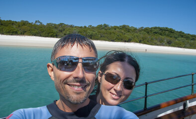 Fototapeta na wymiar Selfie of a happy caucasian couple on vacation ready for snorkeling and diving