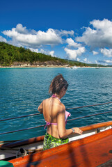 Woman enjoys sailing along the beautiful Queensland coast, Australia