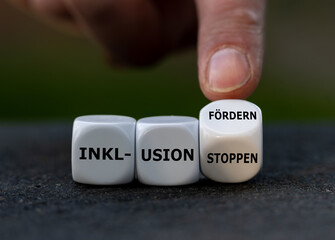 Hand turns dice and changes the German expression 'Inklusion stoppen' (stop inclusion) to...