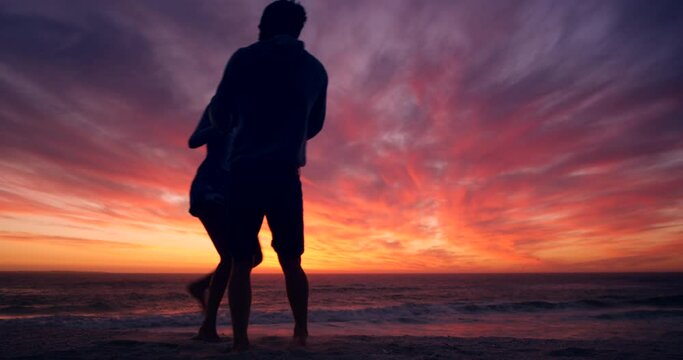 Couple, silhouette and dancing on sunset beach in relax summer holiday, romantic vacation or honeymoon travel location. Fun, dancer and bonding man or love woman by ocean, sea or pink sky at sunrise