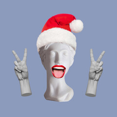 Antique female statue in Santa hat showing a peace gesture with her hands and tongue isolated on a blue color background. Trendy collage in magazine surreal style. 3d contemporary art. Modern design