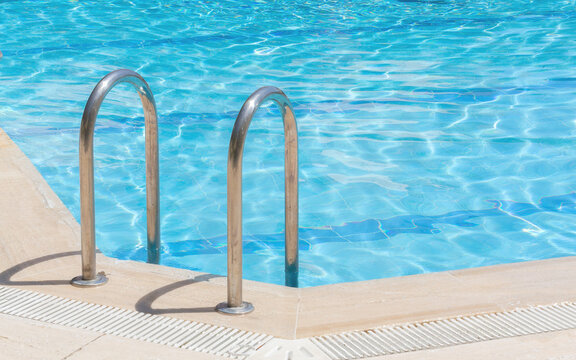 Handrail of the public swimming pool. Horizontal photo